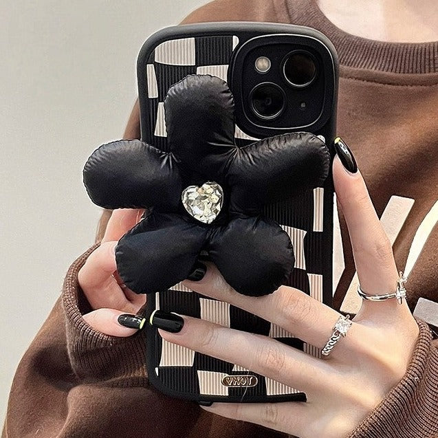 Checkered black and white case with big statement flower